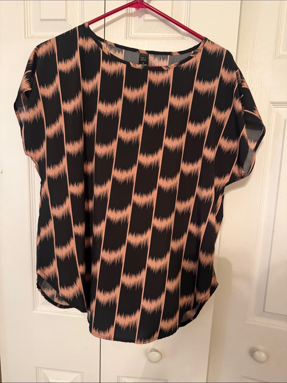 Relaxed Black Blouse with Peach Wave Print
